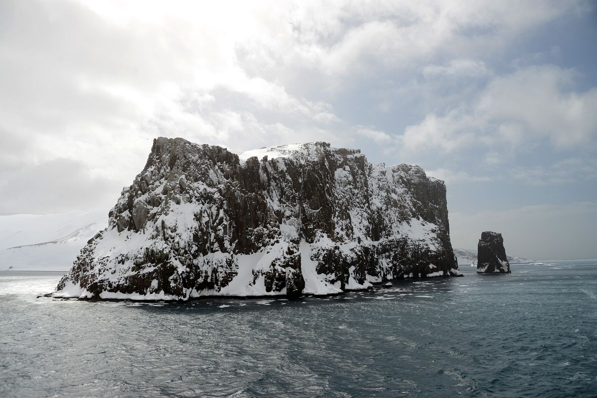 04A Entering The Neptunes Bellows Narrow Opening To Deception Island With Steep Cliffs And Rock Spike On Quark Expeditions Antarctica Cruise Ship